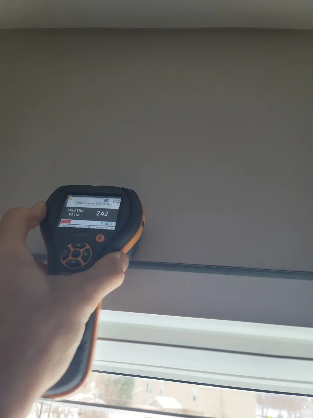 Moisture meter testing during construction quality assessment